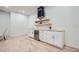 Built-in bar includes wine rack, cabinetry and mini-refrigerator for entertaining at 4322 Timberland Sw Dr, Lilburn, GA 30047