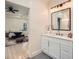 This bathroom is located just off the main bedroom and features a stylish vanity with granite counters at 4322 Timberland Sw Dr, Lilburn, GA 30047