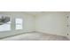 Neutral bedroom features plush carpeting and natural light from two windows at 4322 Timberland Sw Dr, Lilburn, GA 30047