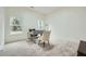 Bright bedroom featuring plush carpeting, neutral paint, and multiple windows for natural light at 4322 Timberland Sw Dr, Lilburn, GA 30047
