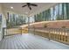 A spacious deck with a wood railing overlooks a landscaped backyard at 4322 Timberland Sw Dr, Lilburn, GA 30047