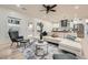 Inviting living room with stylish seating, a ceiling fan, and access to the outdoor deck at 4322 Timberland Sw Dr, Lilburn, GA 30047