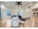 Spacious main bedroom with hardwood floors, tray ceilings, a ceiling fan, and large windows at 4322 Timberland Sw Dr, Lilburn, GA 30047