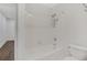 Simple bathroom with a shower/tub combo and updated flooring at 24214 Plantation Ne Dr, Atlanta, GA 30324