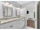 Double vanity bathroom with granite countertop and ample storage at 24214 Plantation Ne Dr, Atlanta, GA 30324