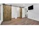 Bedroom with hardwood floors and barn doors at 24214 Plantation Ne Dr, Atlanta, GA 30324
