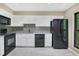 Modern kitchen with white cabinets and black appliances at 24214 Plantation Ne Dr, Atlanta, GA 30324