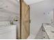 Laundry room features a barn door, washer, dryer, and ample shelving at 24214 Plantation Ne Dr, Atlanta, GA 30324
