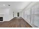 Living room with hardwood floors and large windows at 24214 Plantation Ne Dr, Atlanta, GA 30324
