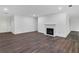 Spacious living room with hardwood floors and fireplace at 24214 Plantation Ne Dr, Atlanta, GA 30324