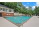 Community swimming pool with plenty of lounge chairs at 24214 Plantation Ne Dr, Atlanta, GA 30324