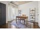 Home office with wood desk, neutral color palette and large window at 3648 Peachtree Ne Rd # 3A, Atlanta, GA 30319