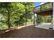 Landscaped backyard with patio, deck, and wooded area at 2741 Prado Ln, Marietta, GA 30066