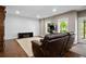 Finished basement with a large sectional couch and entertainment center at 2741 Prado Ln, Marietta, GA 30066