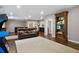 Spacious basement recreation room with a large rug, leather couches and a game arcade at 2741 Prado Ln, Marietta, GA 30066