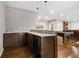 Basement wet bar with granite countertop, dark cabinetry and mini-fridge at 2741 Prado Ln, Marietta, GA 30066