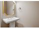 Elegant powder room with pedestal sink and ornate mirror at 2741 Prado Ln, Marietta, GA 30066