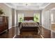 Bright bedroom featuring hardwood floors and large windows at 2741 Prado Ln, Marietta, GA 30066