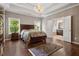 Spacious bedroom with hardwood floors and ensuite bathroom access at 2741 Prado Ln, Marietta, GA 30066