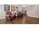 Bonus room with hardwood floors and two leather armchairs at 2741 Prado Ln, Marietta, GA 30066