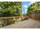 Spacious deck with wooden railings, offering a peaceful backyard view at 2741 Prado Ln, Marietta, GA 30066