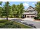 Two-story house with gray siding, brown accents, and a three-car garage at 2741 Prado Ln, Marietta, GA 30066