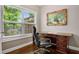 Home office features hardwood floors, large window, and a classic wooden desk at 2741 Prado Ln, Marietta, GA 30066