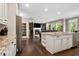Open concept kitchen with island and hardwood floors at 2741 Prado Ln, Marietta, GA 30066