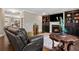 Relaxing living room with hardwood floors, leather recliner, and a fireplace at 2741 Prado Ln, Marietta, GA 30066