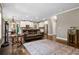 Bright living room with hardwood floors, leather furniture, and a large TV at 2741 Prado Ln, Marietta, GA 30066