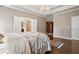 Main bedroom with hardwood floors, a large bed, and access to the bathroom at 2741 Prado Ln, Marietta, GA 30066