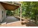 Covered patio with concrete flooring and wooded backdrop at 2741 Prado Ln, Marietta, GA 30066