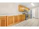 Bright kitchen with ample oak cabinets and stainless steel appliances at 5752 Riverside Walk Dr, Sugar Hill, GA 30518