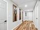 Basement hallway with wood-look floors and modern wall art at 124 Cagle Way, Hiram, GA 30141