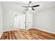 Bright bedroom with wood-look floors and ceiling fan at 124 Cagle Way, Hiram, GA 30141