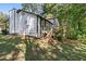 Side view of house with deck and wooded lot at 124 Cagle Way, Hiram, GA 30141