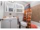 Charming bathroom with a shower/tub combo and patterned curtain at 1276 Westover Nw Trce, Acworth, GA 30102