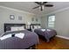 Spacious bedroom with two twin beds and hardwood floors at 300 W Peachtree Ne St # 8E, Atlanta, GA 30308