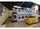 Well-equipped laundry room with multiple washers and dryers at 300 W Peachtree Ne St # 8E, Atlanta, GA 30308