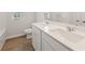 Bathroom with double vanity and a bathtub at 7083 Brushwood Bend (Lot 52), Lithonia, GA 30058