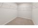 Walk-in closet with wire shelving and carpeted floor at 7083 Brushwood Bend (Lot 52), Lithonia, GA 30058