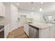 Kitchen with island, granite countertops, and stainless steel appliances at 7083 Brushwood Bend (Lot 52), Lithonia, GA 30058