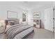 Virtually staged bedroom with queen bed and built-in shelving at 3335 Briaroak Dr, Duluth, GA 30096