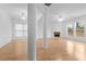 Living room featuring hardwood floors, a fireplace, and large windows at 3335 Briaroak Dr, Duluth, GA 30096