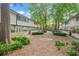 Community courtyard with landscaping and sitting area at 6940 Roswell Rd # 24E, Sandy Springs, GA 30328