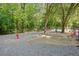 Fenced dog park with waste disposal and seating at 6940 Roswell Rd # 24E, Sandy Springs, GA 30328