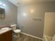 Bathroom with wood vanity, gray walls, and a tub shower combo at 967 Metropolitan Sw Pkwy, Atlanta, GA 30310