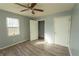 Bright bedroom with ceiling fan and wood-look floors at 967 Metropolitan Sw Pkwy, Atlanta, GA 30310