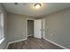 This bedroom features a closet, luxury vinyl plank flooring, and neutral paint at 967 Metropolitan Sw Pkwy, Atlanta, GA 30310