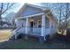 Gray house with white trim and a front porch at 967 Metropolitan Sw Pkwy, Atlanta, GA 30310